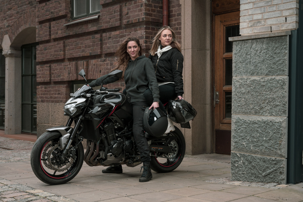 two women on motorcycle with zipcov tank protector